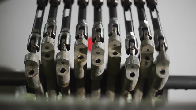 Close-up loom mechanisms. Production line of polypropylene bags for food and non-food bulk goods. PP bag