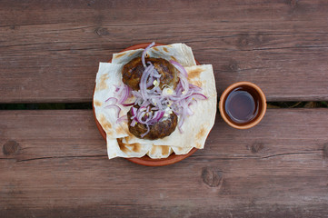 grilled abkhazura in a ceramic bowl