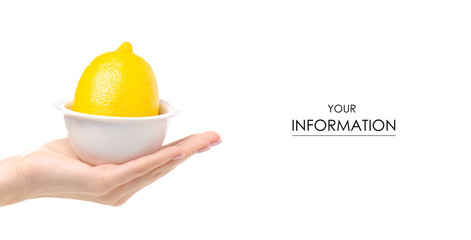 Lemon in white bowl in hand pattern on white background isolation