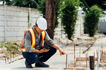 Man construction engineer at construction site