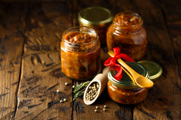 Homemade roasted vegetables sauce in jars