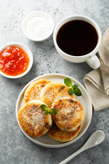 Homemade cottage cheese pancakes on white plate