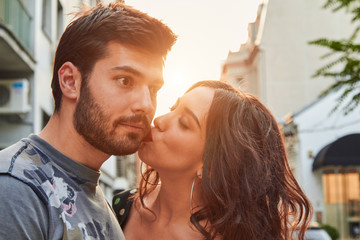 Cute young couple outdoors on the street.