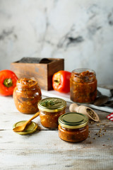 Homemade roasted vegetables sauce in jars