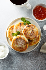 Homemade cottage cheese pancakes on white plate