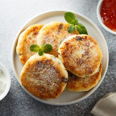 Homemade cottage cheese pancakes on white plate