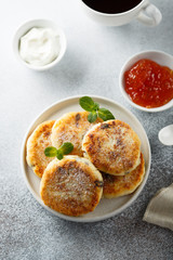 Homemade cottage cheese pancakes on white plate