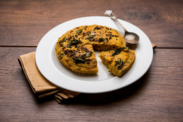 Handvo/handwa is a vegetable cake originating from the Gujarat, India. selective focus