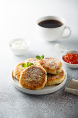 Homemade cottage cheese pancakes on white plate