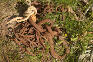 rusty fishermans chain & rope in grass