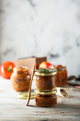 Homemade roasted vegetables sauce in jars