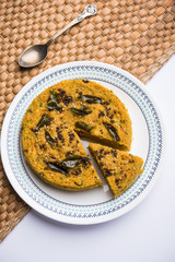 Handvo/handwa is a vegetable cake originating from the Gujarat, India. selective focus