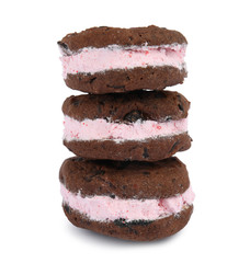Sweet delicious ice cream cookie sandwiches on white background