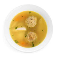 Bowl of Jewish matzoh balls soup isolated on white, top view