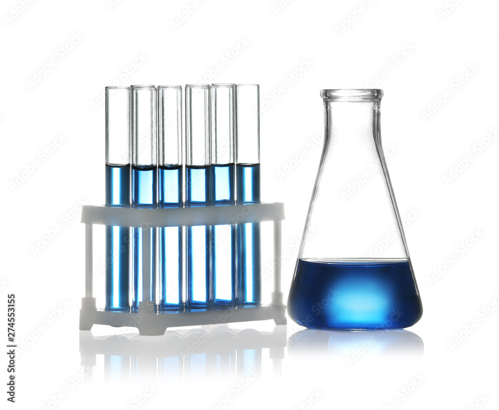 Wall mural test tubes in rack and conical flask with liquid samples on white background. chemistry glassware