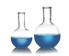 Florence flasks with liquid samples on white background. Chemistry glassware