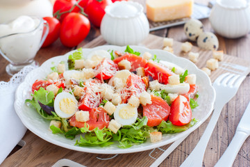Caesar salad with red fish on the wooden table, horizontal
