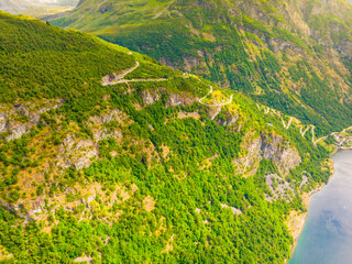 Eagle road winding in mountains from village Geiranger to Ornesvingen viewing point More og Romsdal...