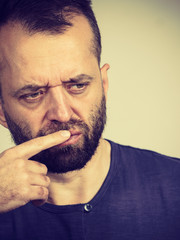 Confused focused serious man thinking