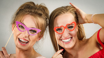 Two women with carnival masks