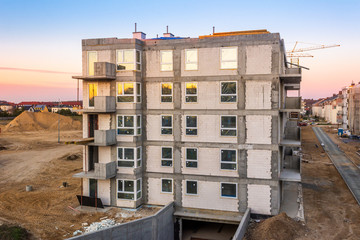 Modern apartment building on a construction site.