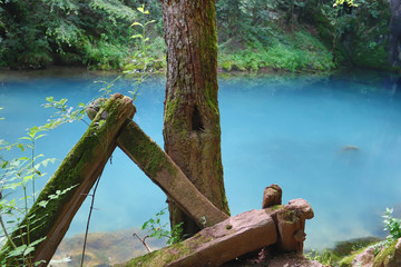 Amazingly beautiful mountain's spring with heavenly blue water color and small waterfall named Krupajsko Vrelo (spring of Krupaj), near Krupaja village, Eastern Serbia 