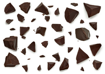 Dark chocolate pieces or parts isolated on white background