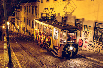 Stop of a cable car in the capital of Portugal. Stop illuminated with lighting in Lisbon and the...