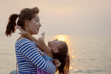 beautiful moment with mom and kid play and hug