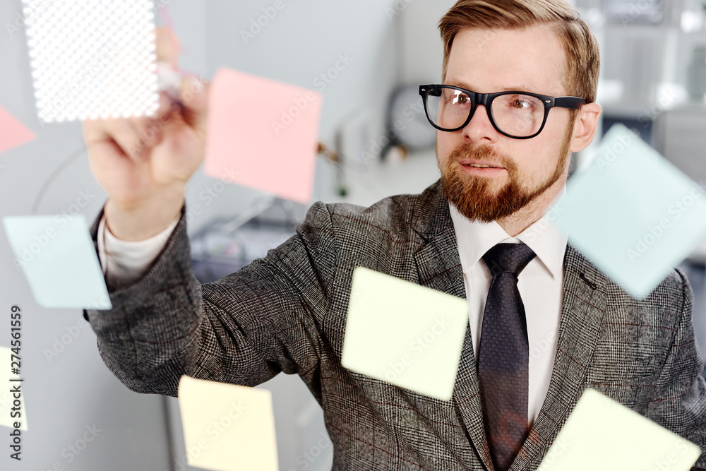 Wall mural mid age businessman working on new project at modern office