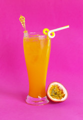 Passion fruit juice on pink background