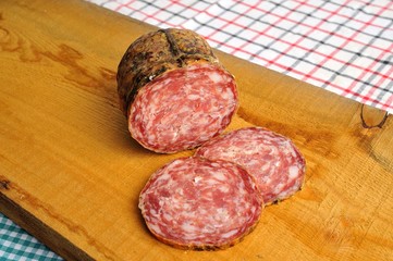 typical traditional Italian salami with bread and suppressed for a snack with healthy food