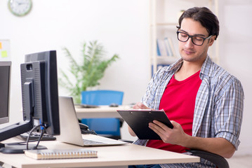 Male it specialist working in the office 