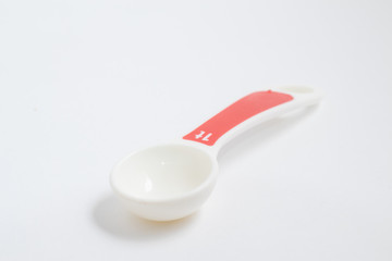 Tea spoon. White Measuring spoon