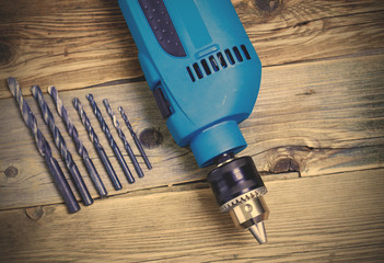 electric drill with a set of drill bits