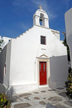 charming little orthodox chapel in a narrow street of Mykonos (Greece), Cyclades island in the heart of the Aegean Sea