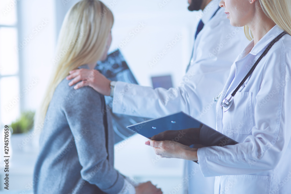 Wall mural doctor and patient discussing scan results in diagnostic center