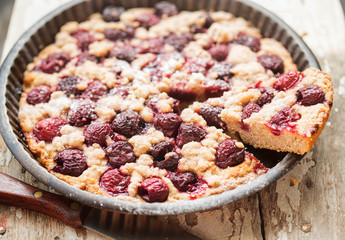 Cherry pie with crumble in vintage form 