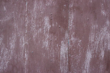 Painted brown metal sheet in two parts.