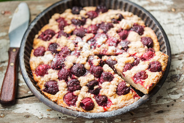 Cherry pie with crumble in vintage form 