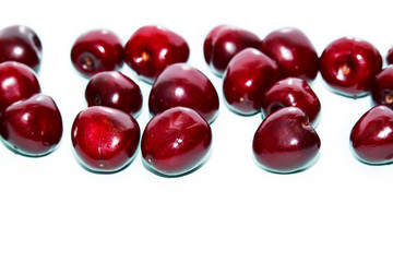 Fresh cherry on wooden white background. Fresh ripe cherries. Sweet cherries.