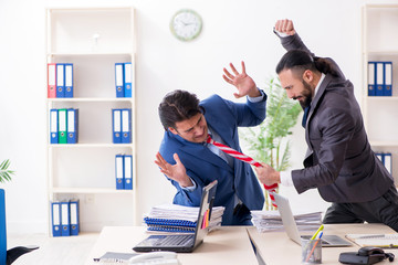 Two male colleagues in the office 