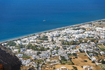 Fototapeta na wymiar Beautiful Perissa Black Sand Beach, Greece, Cyclades islands, Santorini island, aerial view