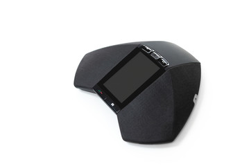 Modern telephone IP conference device on the white table with city scape view for teleconferance technology concept