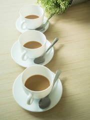 coffee three cup on wood table