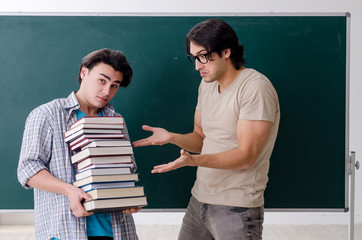 Two male students in the classroom 