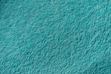 Fototapeta na wymiar Blue leather texture closeup, useful as background.