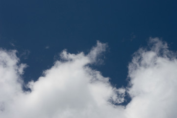 Summer sunny sky with cumulus clouds.