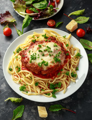 Chicken Parmesan with Cheese and Marinara Sauce served over spaghetti, pasta