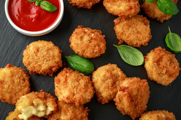 Fried Mac, macaroni and Cheese Bites in breadcrumbs with ketchup sauce